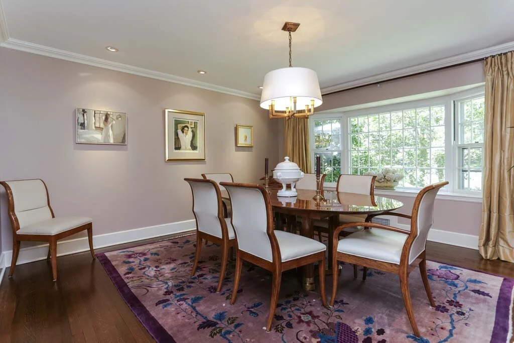 Dining room with wooden table and chandelier