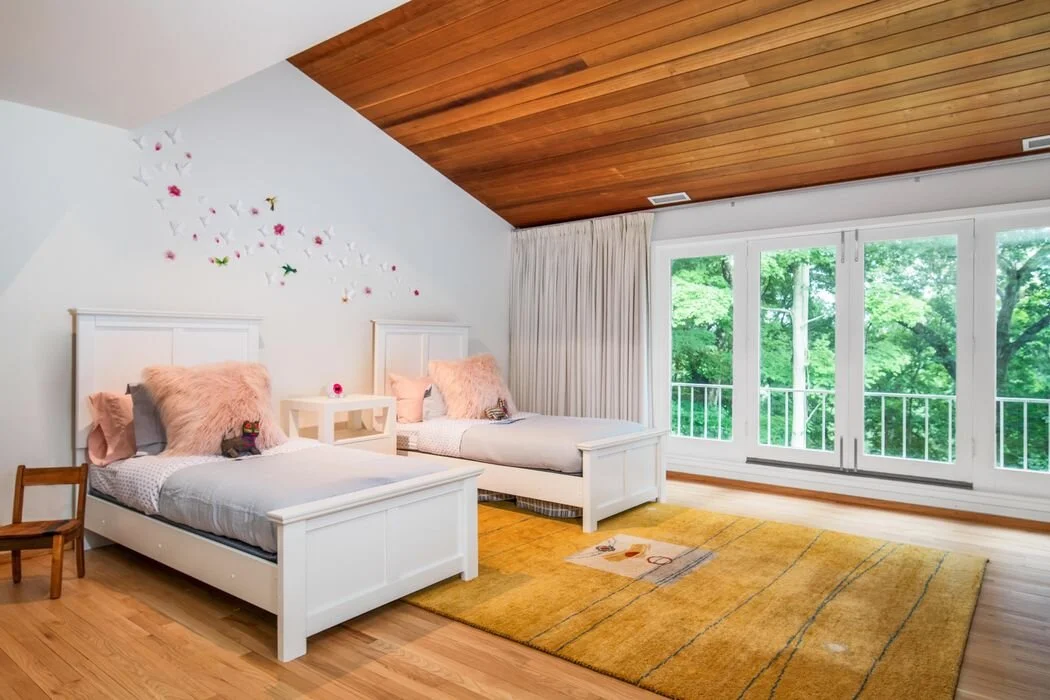 Children's bedroom with twin beds and garden views